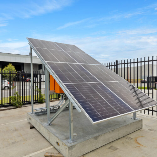 Transportable solar skid sitting in an industrial area